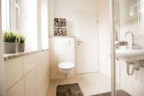 Combined shower/tub, hair dryer, towels, toilet paper