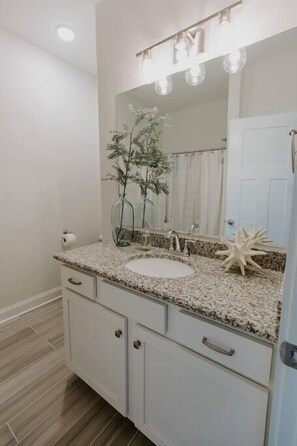 Bathtub, hair dryer, towels