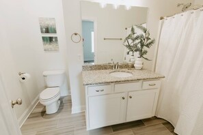 Bathtub, hair dryer, towels