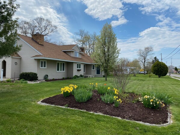 A single-story house with a sloped roof and a front porch.