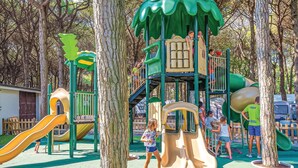 A playground with slides and climbing structures surrounded by trees. - Stunning home in Lido di Spina FE with swimming pool (Lido di Spina FE)