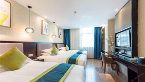 A hotel room with two beds, a desk, a TV, and artwork on the walls. - Lifeng Tangguo Hotel (Jinhua)