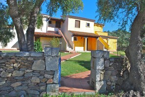 Set amidst lush greenery, this traditional two-story residence offers a serene and environment.