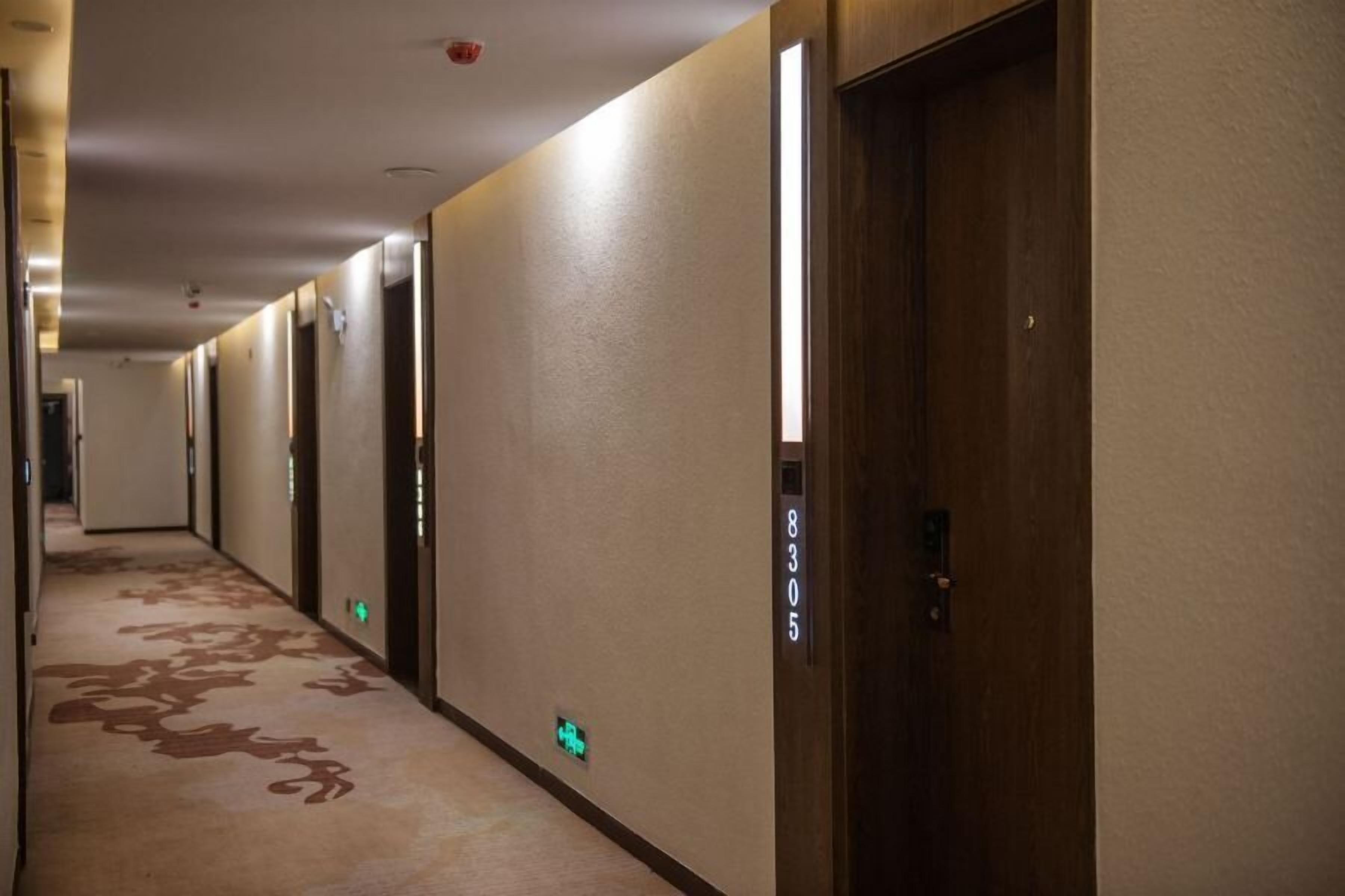 A hotel hallway with doors numbered 8305, 8306, and 8307.
