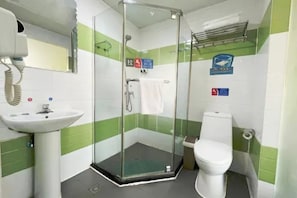 A bathroom with a glass-enclosed shower, a sink, and a toilet. - 7 Days inn Chongqing (Chongqing)