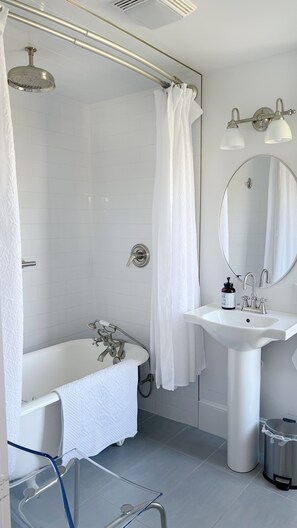 Bathtub, hair dryer, towels, soap