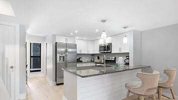 Coffee/tea maker, fridge, microwave, oven