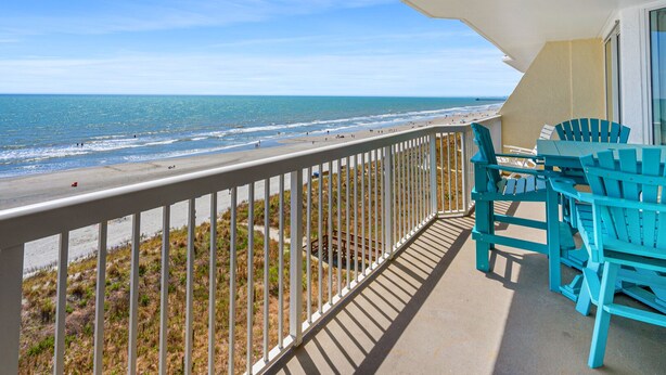 A balcony with a view of the beach and ocean. - So many amenities! Oceanfront condo w/outdoor features, pools, lazy river, kids' pool (North Myrtle Beach)
