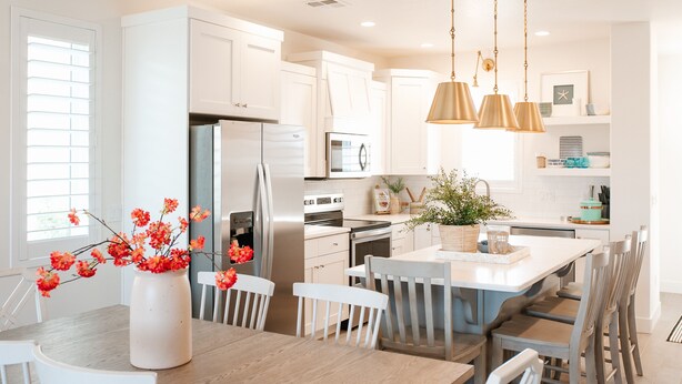 A modern kitchen with white cabinetry, stainless steel appliances, and a central island with seating. - North Hampton | Pool, Hot Tub & Family-Friendly Spaces Near St. George (Washington)