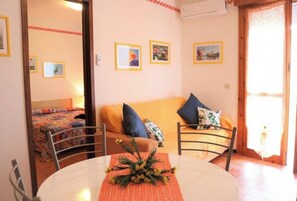 Apartment, 1 Bedroom, Balcony, City View | Living area | TV