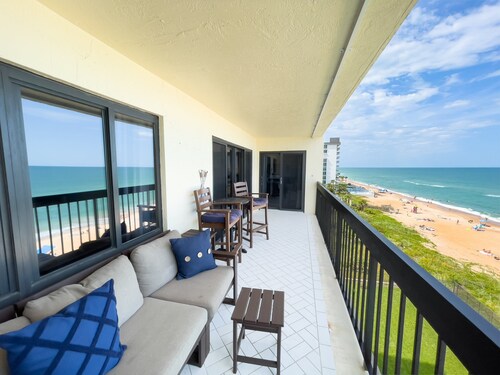 Updated direct oceanfront corner condo with private balcony, heated pool and garage