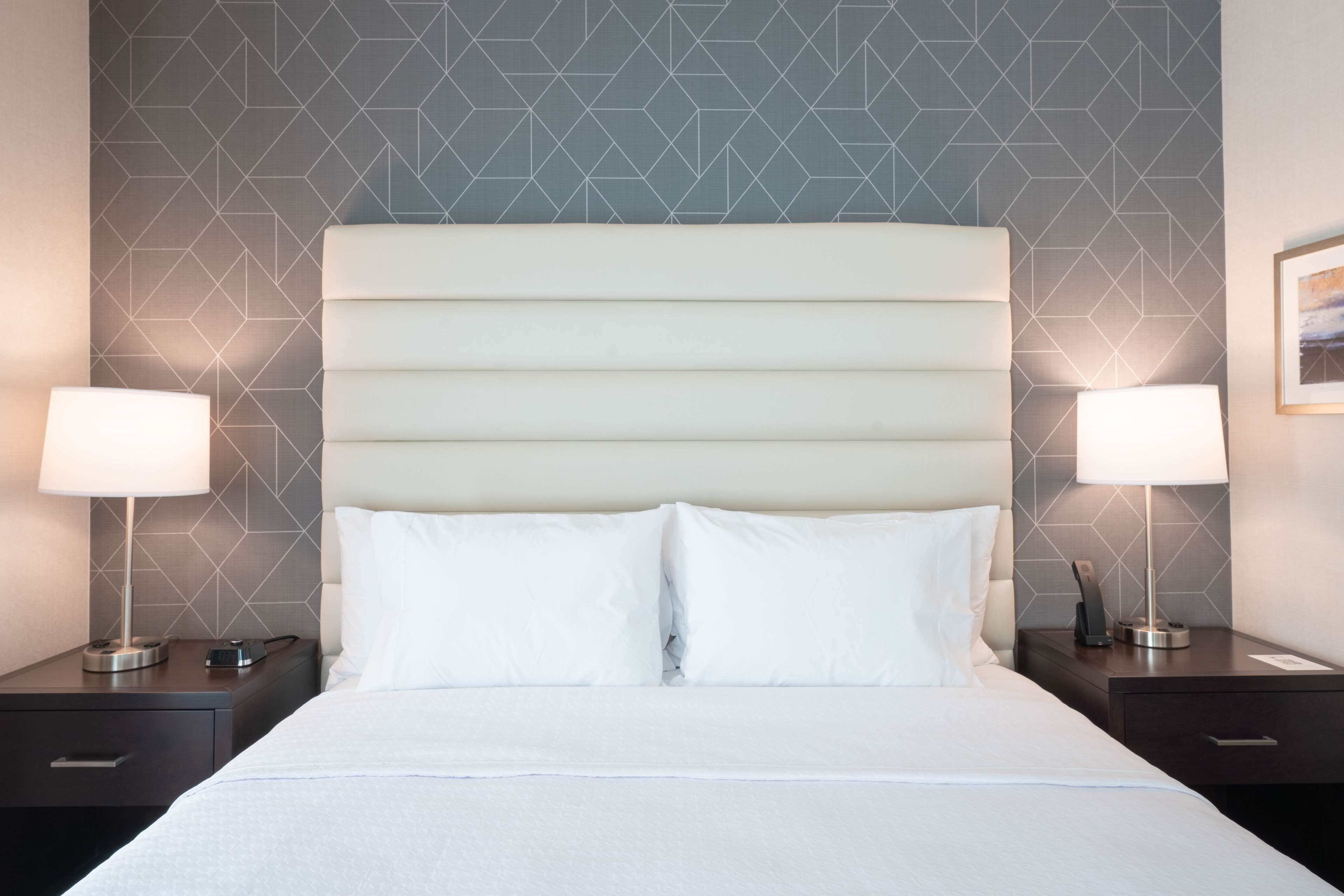 hypo-allergenic bedding, desk, laptop workspace, blackout curtains