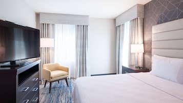 Hypo-allergenic bedding, desk, laptop workspace, blackout curtains