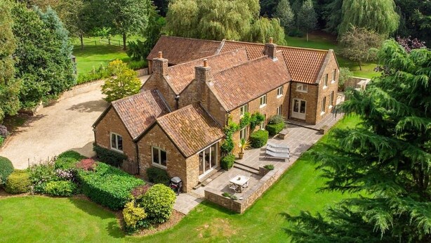 A large, two-story house with a spacious patio area and a well-maintained lawn. - Stunning Country Farm House between Bristol & Bath (Bristol)