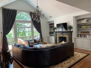 Smart TV, fireplace, books, printers