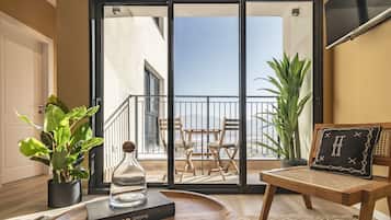 One Bedroom Apartment with Balcony | Living room | 40-inch Smart TV with cable channels, TV