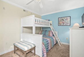 A bedroom with a bunk bed, a small bench, a desk, and a map on the wall. - Somerset@2nd St- truly 1 of a kind. This OF 3 br is huge, will beautiful appointments throughout. (Ocean City)