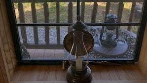 A wooden window with a view of a pond and trees. - Big Mike's Cabin on the lake, next to ball diamonds nestled in 3 -cabin village (Hamersville)