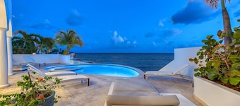 Beachfront villa with concierge service, housekeeping, airport pickup, pool