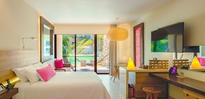 A modern hotel room with a large bed, a desk with a chair, a dining area, and a TV.