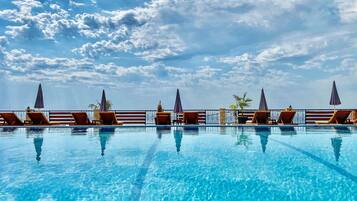 Seasonal outdoor pool, open 9:00 AM to 9:00 PM, free cabanas