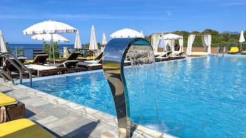 Seasonal outdoor pool, free pool cabanas, pool umbrellas