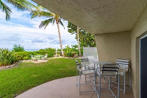 Outdoor dining - Oceanfront Bliss–Longboat Key Beach 106 by RVA (Longboat Key)