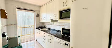 Fridge, microwave, oven, cookware/dishes/utensils