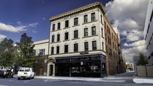 A corner building with a storefront labeled "Fruci Building" and a sign for "The Make-Up Studio".