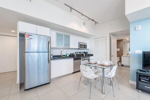 Enjoy meals in the kitchen with a dining area and access to a separate room.
