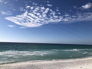 A beach with clear skies and waves.