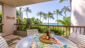 Enjoy ocean views and sunset moments from this balcony, complete with a table for two.