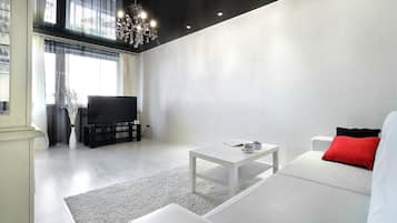Standard Apartment | Living area | 42-inch flat-screen TV with cable channels, TV