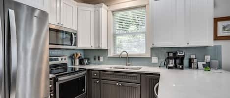 Coffee/tea maker, fridge, microwave, oven