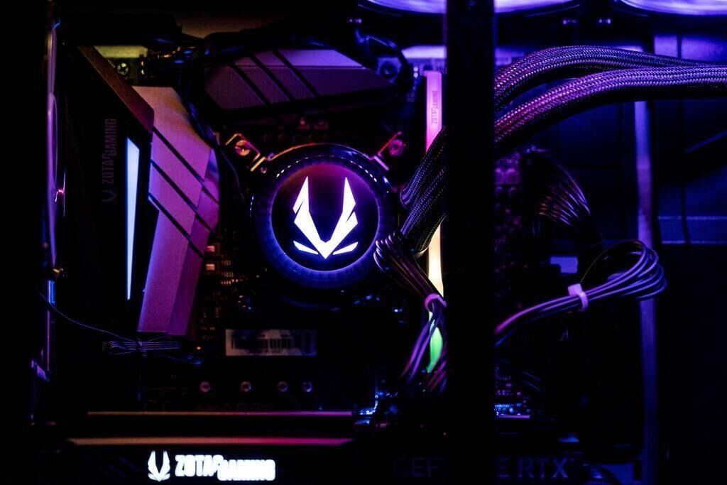 A computer case with a prominent logo and various cables.