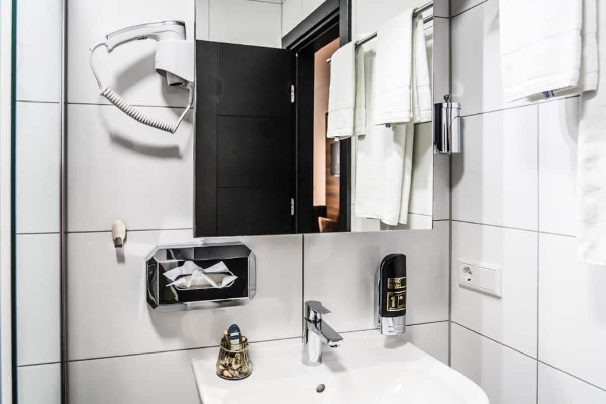 shower, hair dryer, heated floors, towels