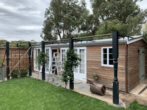Residential property with a secure entrance and well-manicured lawn.