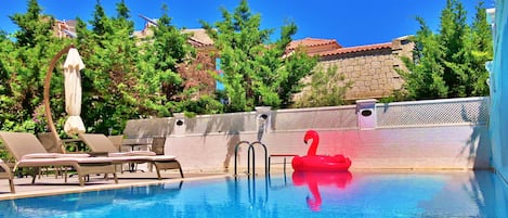 Outdoor pool, open 9:00 AM to 9:00 PM, pool umbrellas, sun loungers