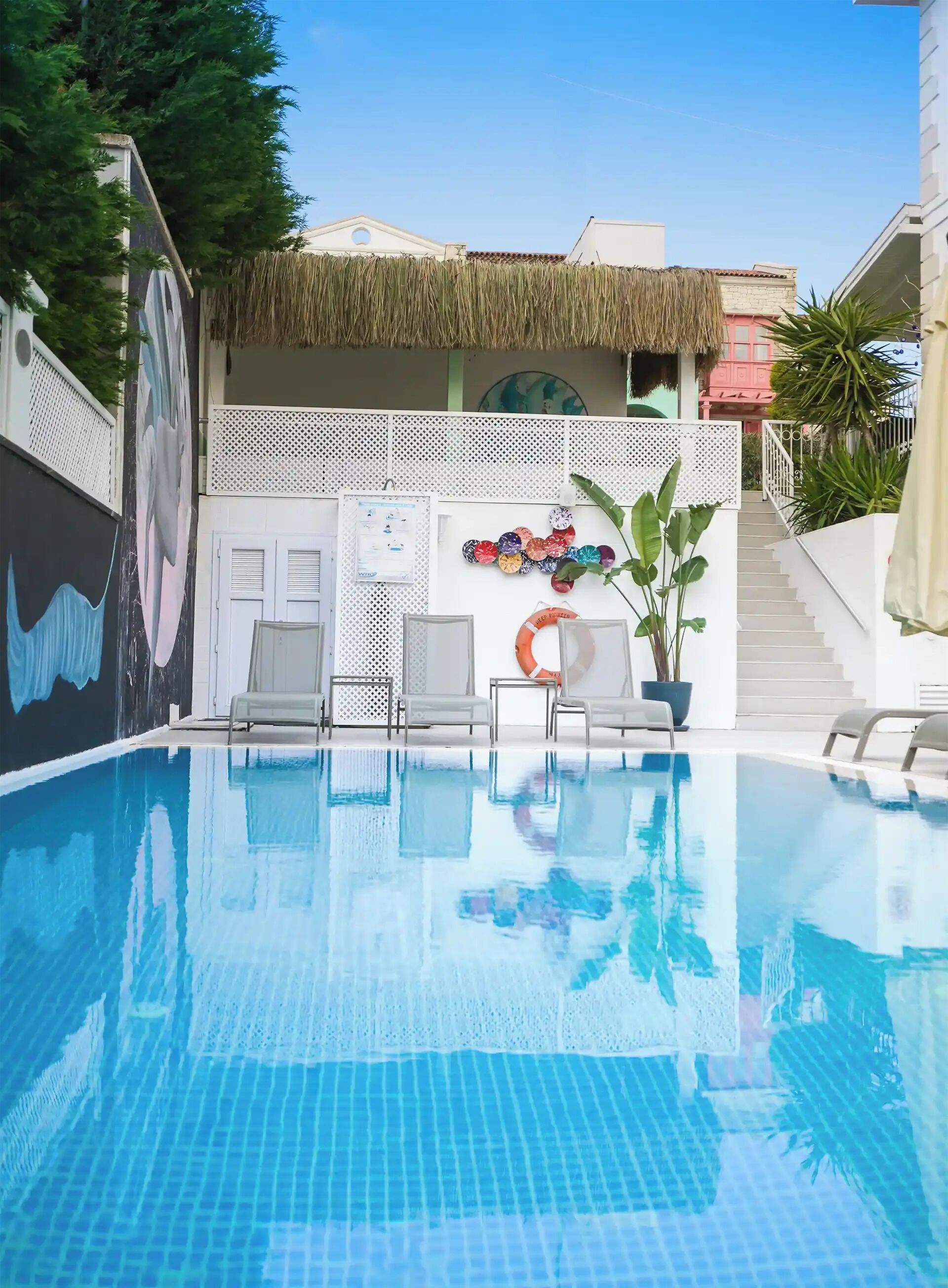 Outdoor pool, open 9:00 AM to 9:00 PM, pool umbrellas, pool loungers