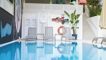 Outdoor pool, open 9:00 AM to 9:00 PM, pool umbrellas, pool loungers