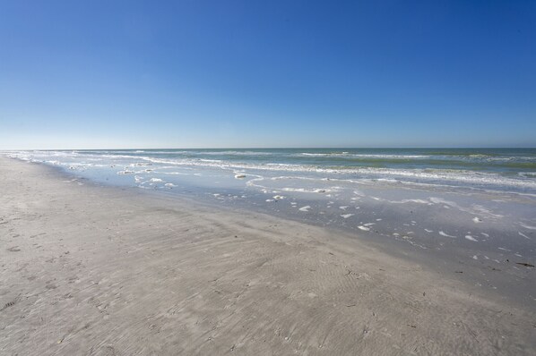 On the beach, sun-loungers, beach towels