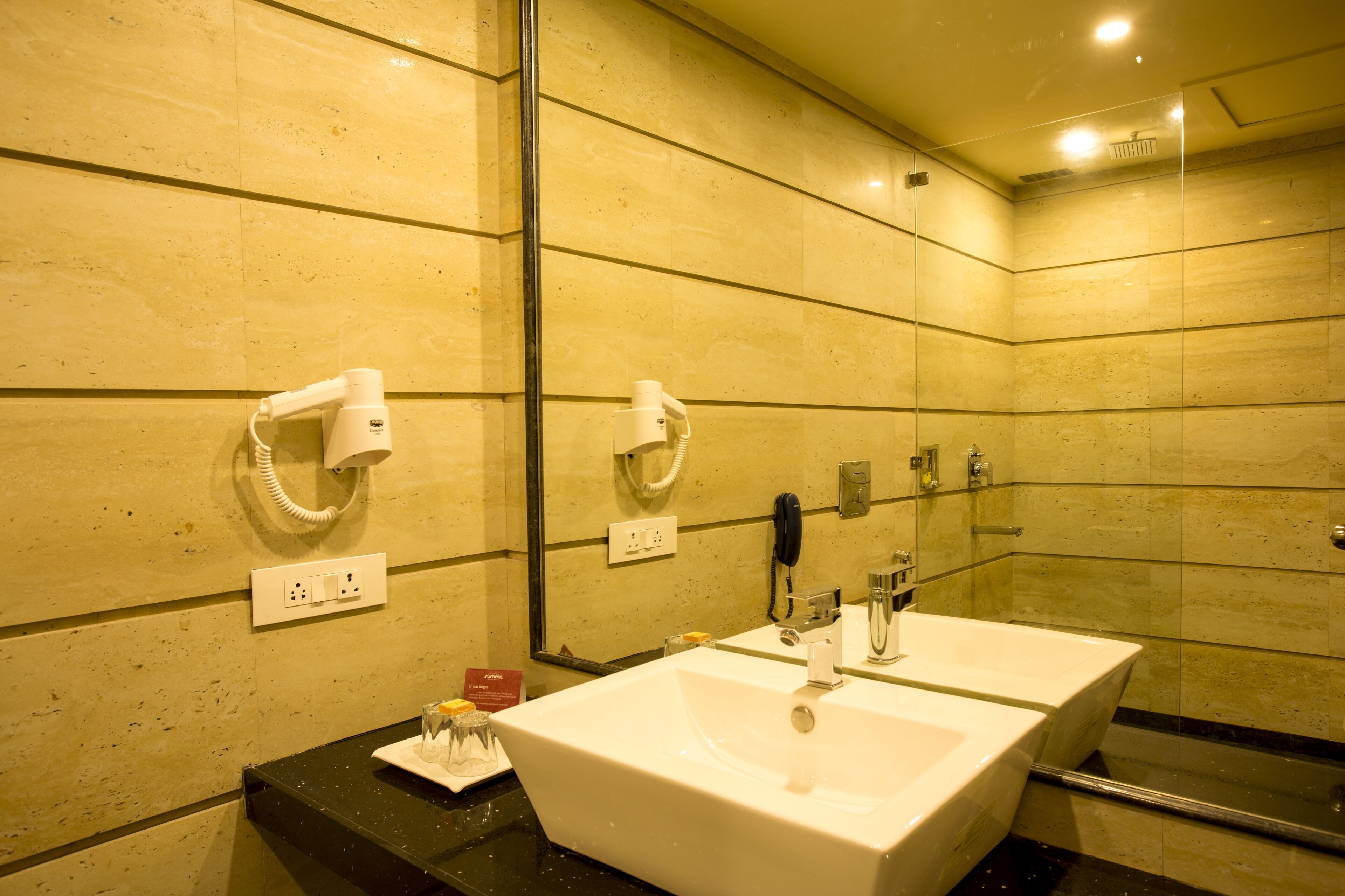 designer toiletries, hair dryer, slippers, soap