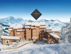 Experience the serene beauty of the mountains from this hotel's contemporary design, featuring large windows and a flat roof.