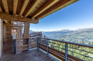 Enjoy a panoramic view of the surrounding mountains from this balcony.