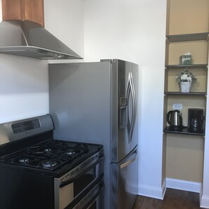 Microwave, dishwasher, coffee/tea maker, cookware/dishes/utensils