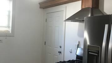 Microwave, dishwasher, coffee/tea maker, cookware/dishes/utensils