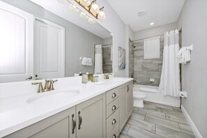 Bathtub, hair dryer, towels, soap