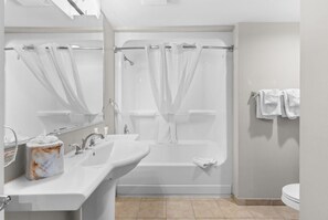 Combined shower/bathtub, hair dryer, towels, soap