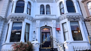 A building with "White Court" signs, a black iron gate, and a "NO VACANCIES" sign. - White Court Llandudno (Llandudno)