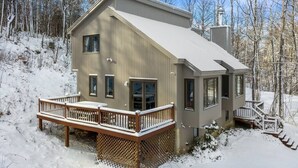 A two-story house with a deck and a chimney. - Brand New Kitchen & Bathrooms, close to Mt Snow! (Dover)